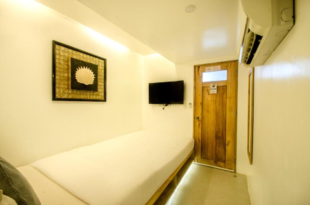 TV a/nebo společenská místnost v ubytování Zuzuni Boutique Hotel