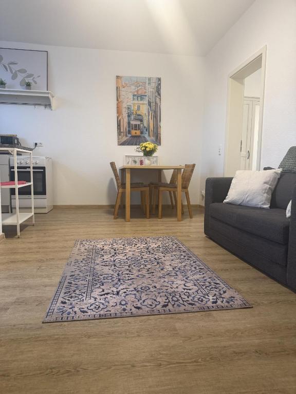 a living room with a couch and a table at Wupper Apartments Vogel in Erbschlö