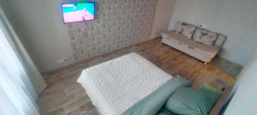 Ένα ή περισσότερα κρεβάτια σε δωμάτιο στο Рахмет