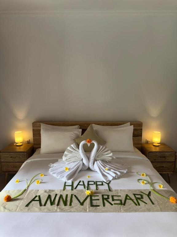 Ένα ή περισσότερα κρεβάτια σε δωμάτιο στο D'Kusuma House Sidemen