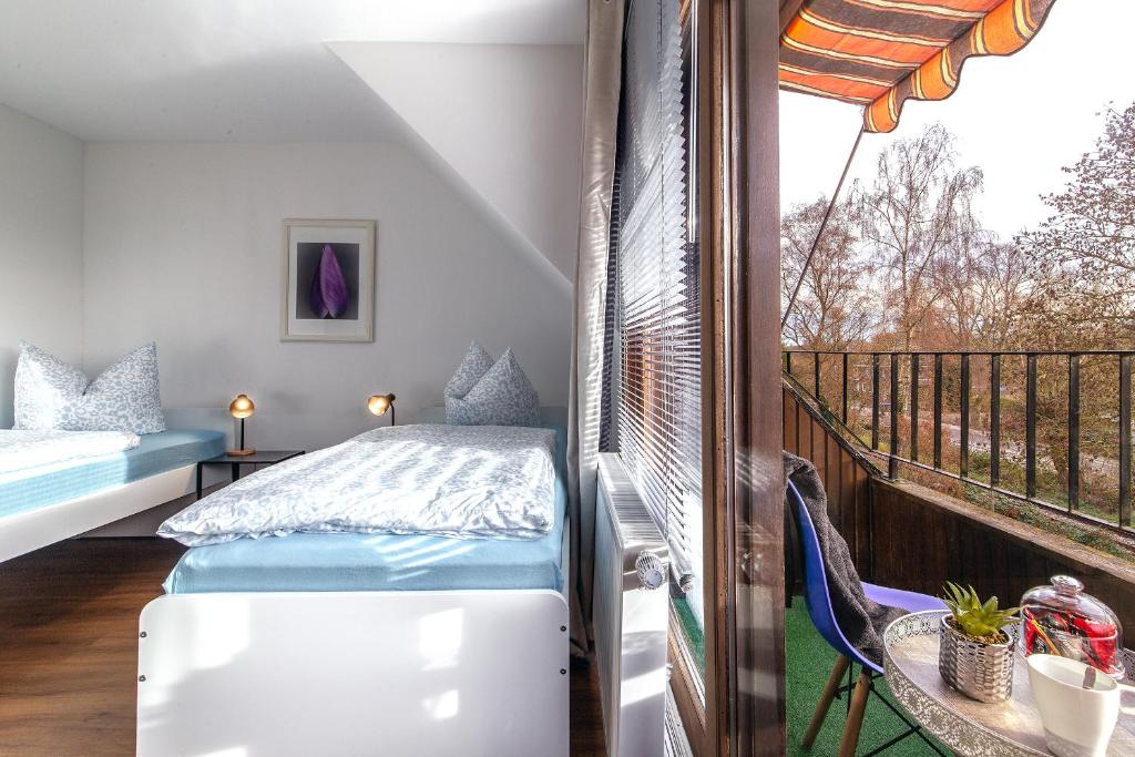 En eller flere senge i et værelse på Appartment Haus Rothenhaus Hamburg