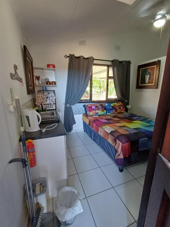 En eller flere senge i et værelse på Sunrise Holidays