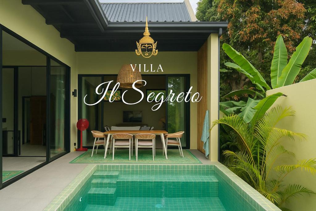 a restaurant with a table and chairs and a pool at Villa IL SEGRETO Koh Samui in Ban Lamai