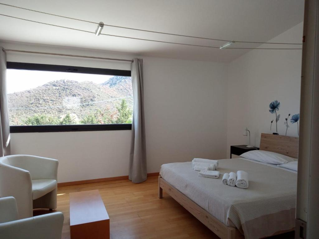 Ένα ή περισσότερα κρεβάτια σε δωμάτιο στο Natur Hotel Tanca