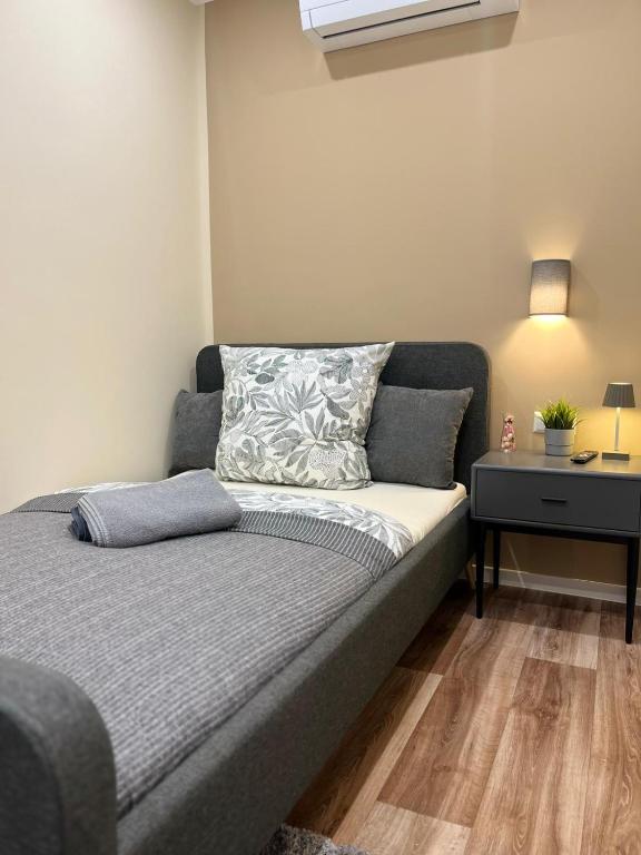 a couch in a room with a table and a bed at Live-In Room 6 - Klimatisiert - Coffee for free - in Karlsruhe