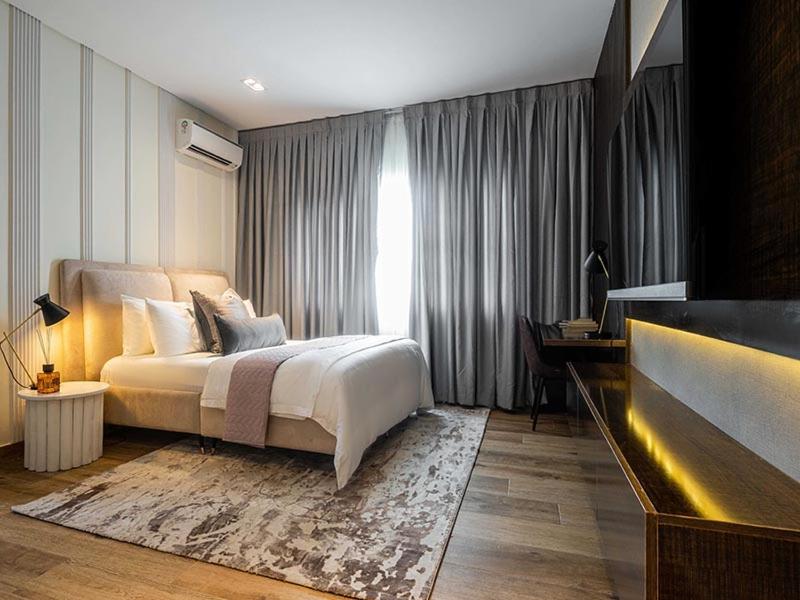 Ένα ή περισσότερα κρεβάτια σε δωμάτιο στο Azusa Hotels and Apartments