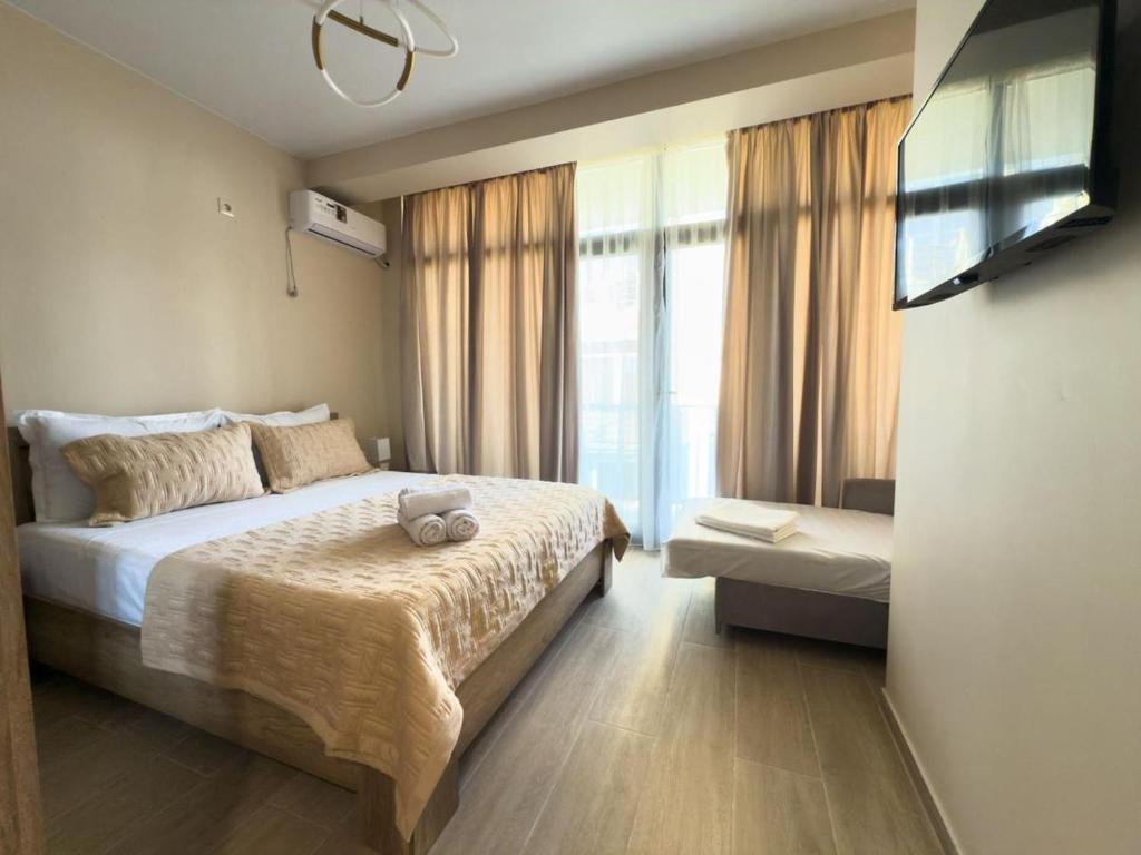 Ένα ή περισσότερα κρεβάτια σε δωμάτιο στο Villas David