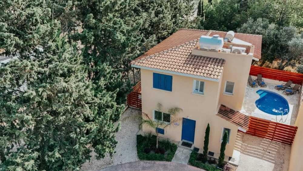 an aerial view of a house with a swimming pool at Villa Aphrodite in Paradise Gardens - 3bd with Private Pool by VICHY Holidays in Nea Paphos