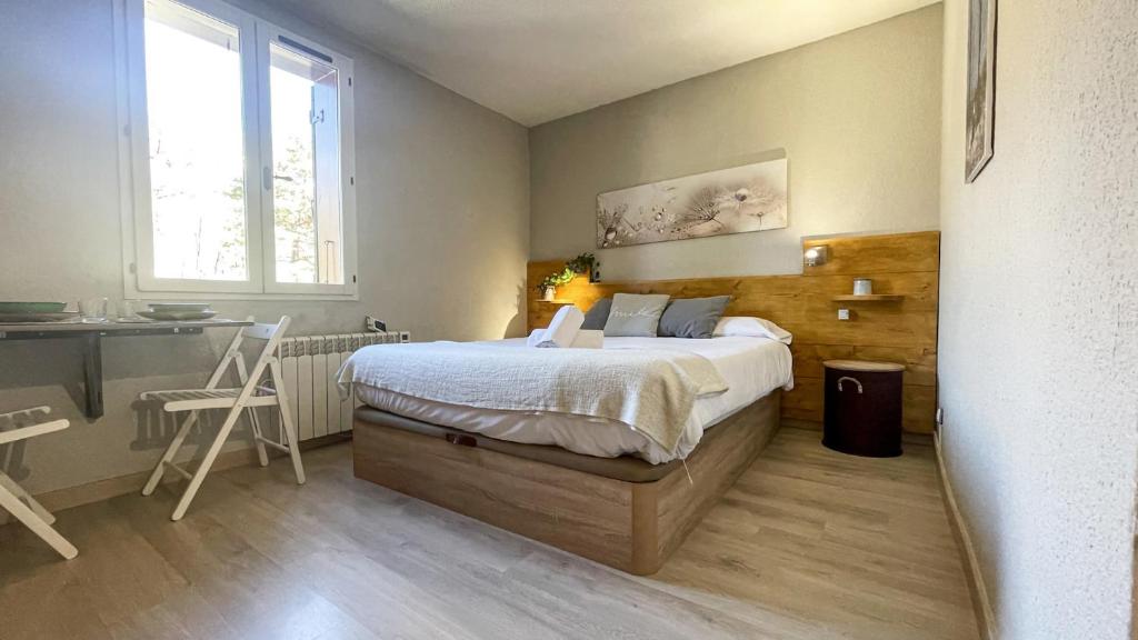 Ένα ή περισσότερα κρεβάτια σε δωμάτιο στο Apartamento ideal para parejas en Enveitg