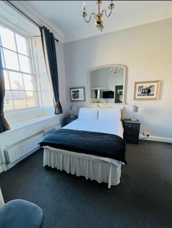 Postel nebo postele na pokoji v ubytování The Ilchester Arms