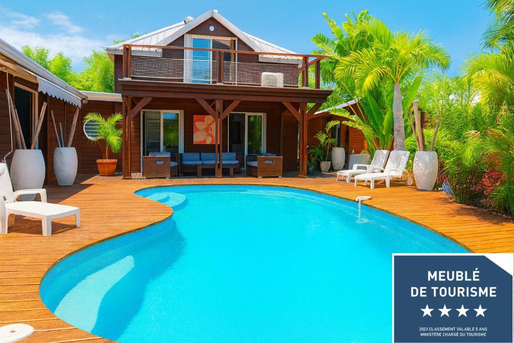 Πισίνα στο ή κοντά στο Villa CINTA piscine chauffée 100 m du lagon