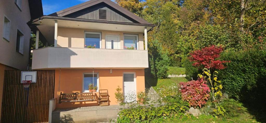 a large house with a porch and a balcony at Holiday House with scenic Apartment in Ptuj