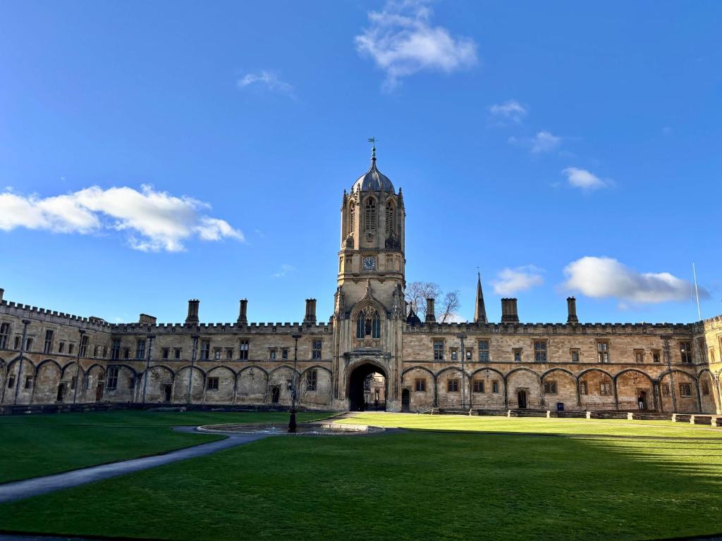 a large building with a clock tower on top of it at 117 St Aldates Christ Church Accommodation in Oxford
