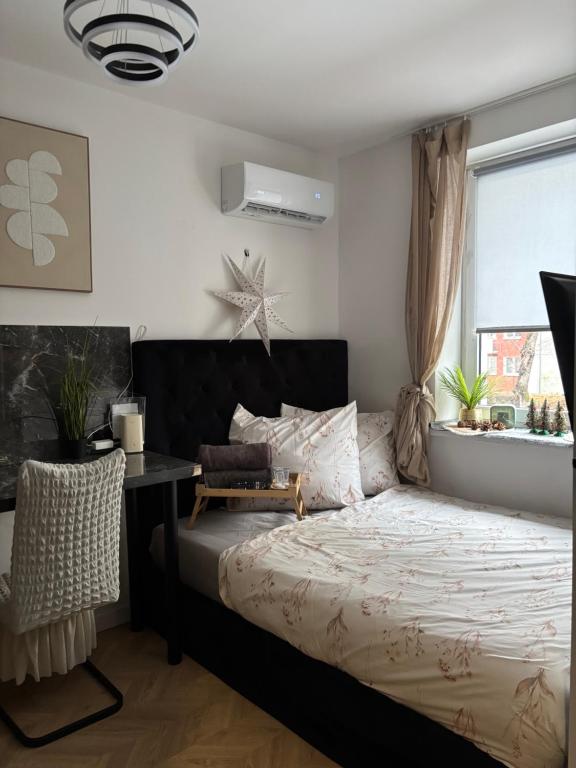 Postel nebo postele na pokoji v ubytování Cute apartament