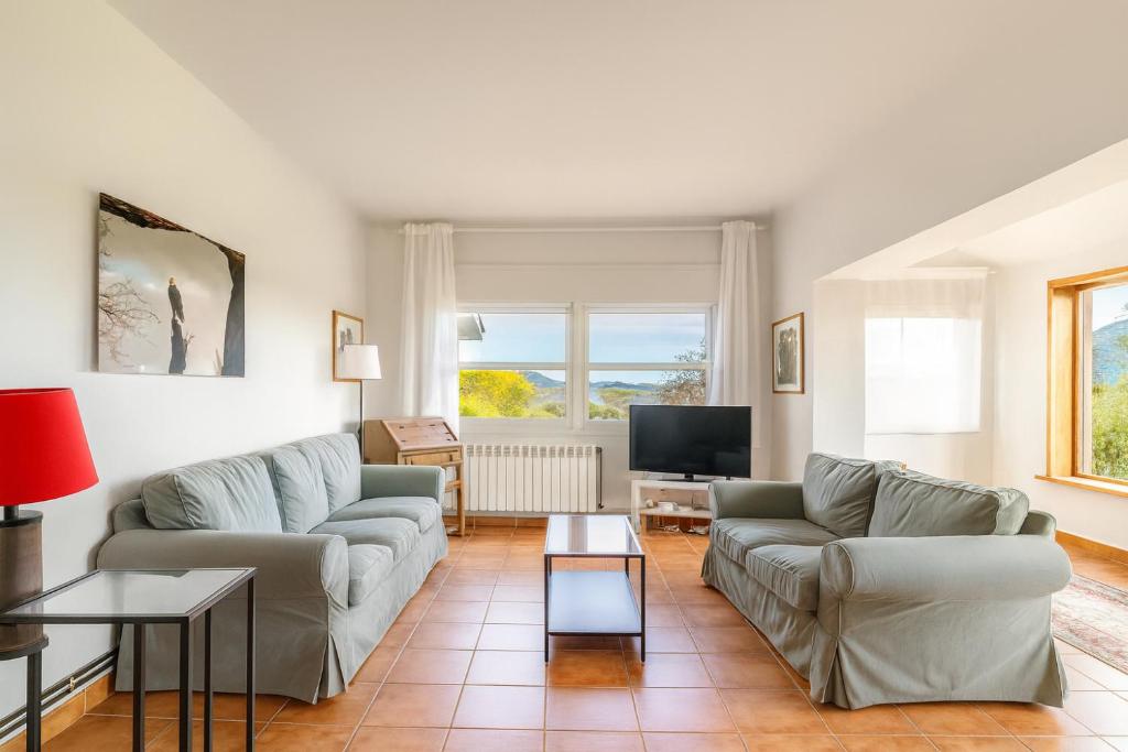 Μια τηλεόραση ή/και κέντρο ψυχαγωγίας στο Casa con Jardín Enorme y Vistas Espectaculares Cerca de Pechon