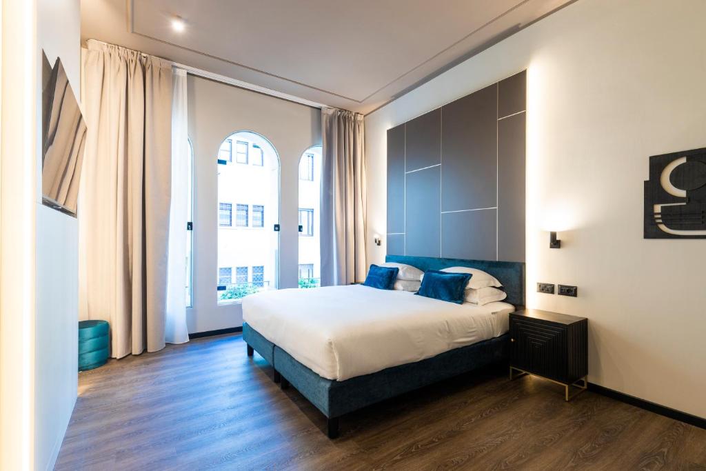 En eller flere senge i et værelse på AH - Collezione Brera