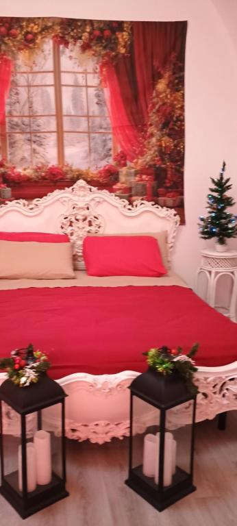 a bedroom with a white bed with a red blanket at Oasi di san Benedetto in Castellaneta