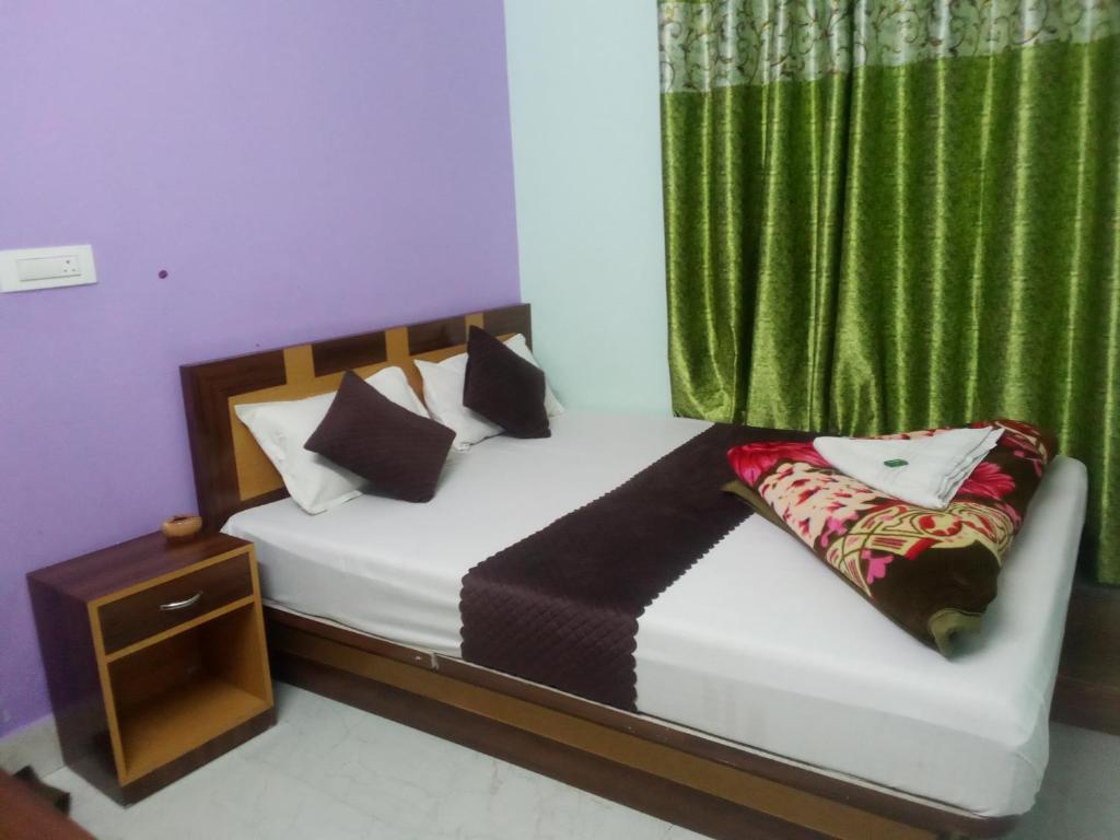 Ένα ή περισσότερα κρεβάτια σε δωμάτιο στο Durga guest house