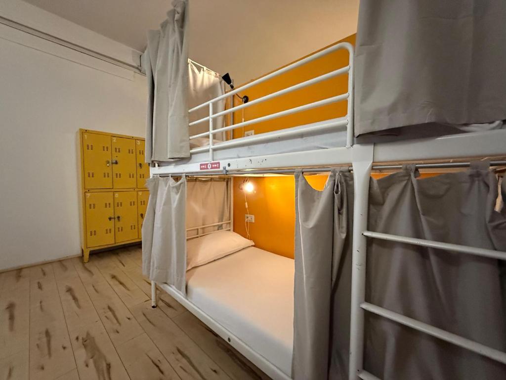 Ένα ή περισσότερα κρεβάτια σε δωμάτιο στο QUO Milano