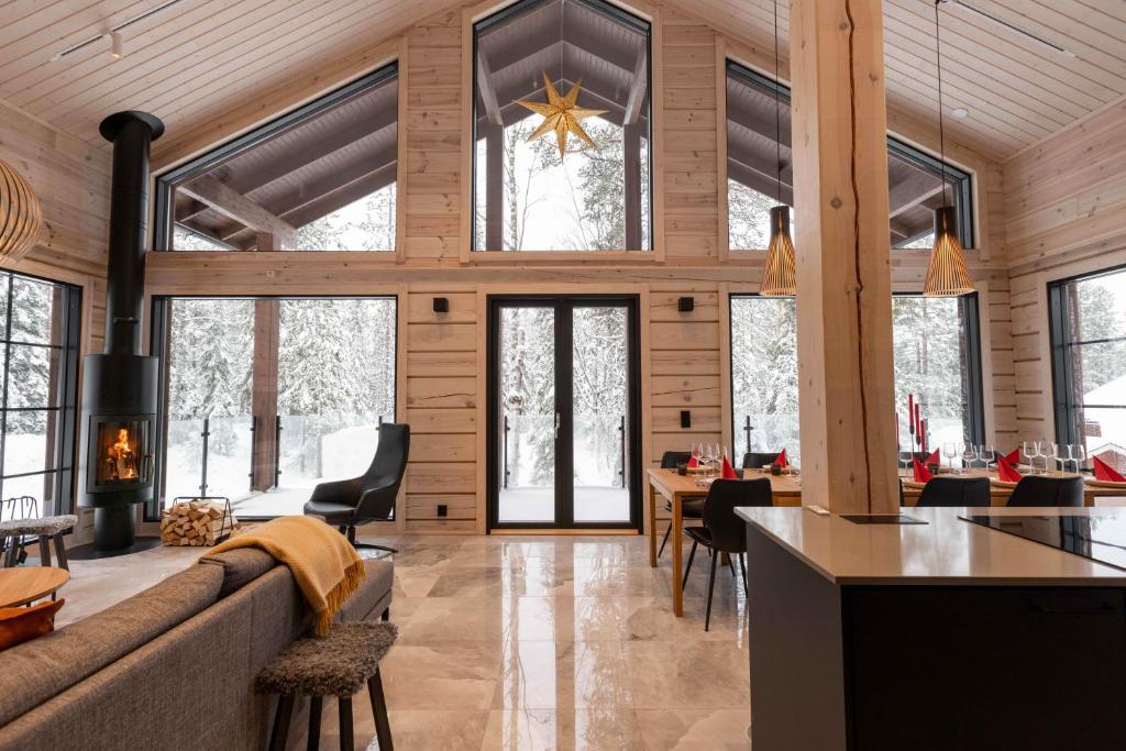 a living room with a couch and a table at Villa Levilla, luxury in Levi in Levi