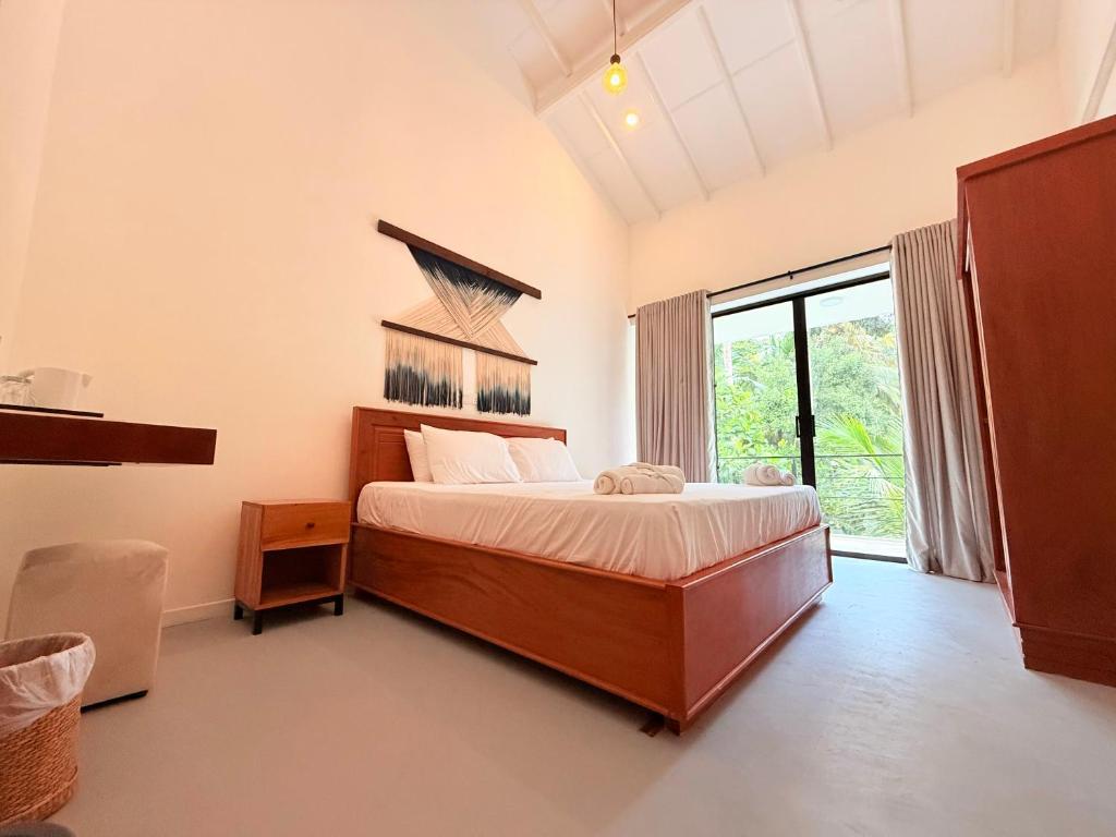 Кровать или кровати в номере Kavana Resort and Villa