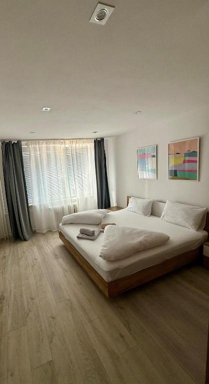 a bedroom with a large bed in a room at Thurzova Residence 5 in Martin