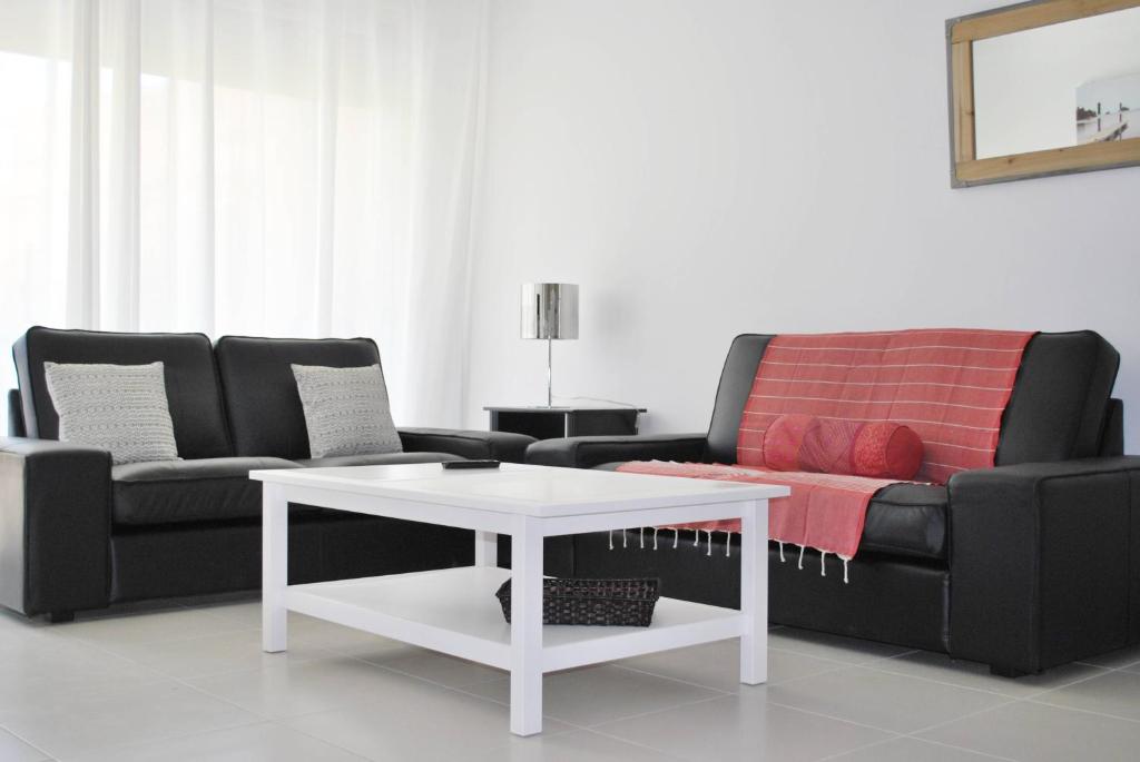 a living room with a couch and a coffee table at Colore di Mare in Cavalaire-sur-Mer