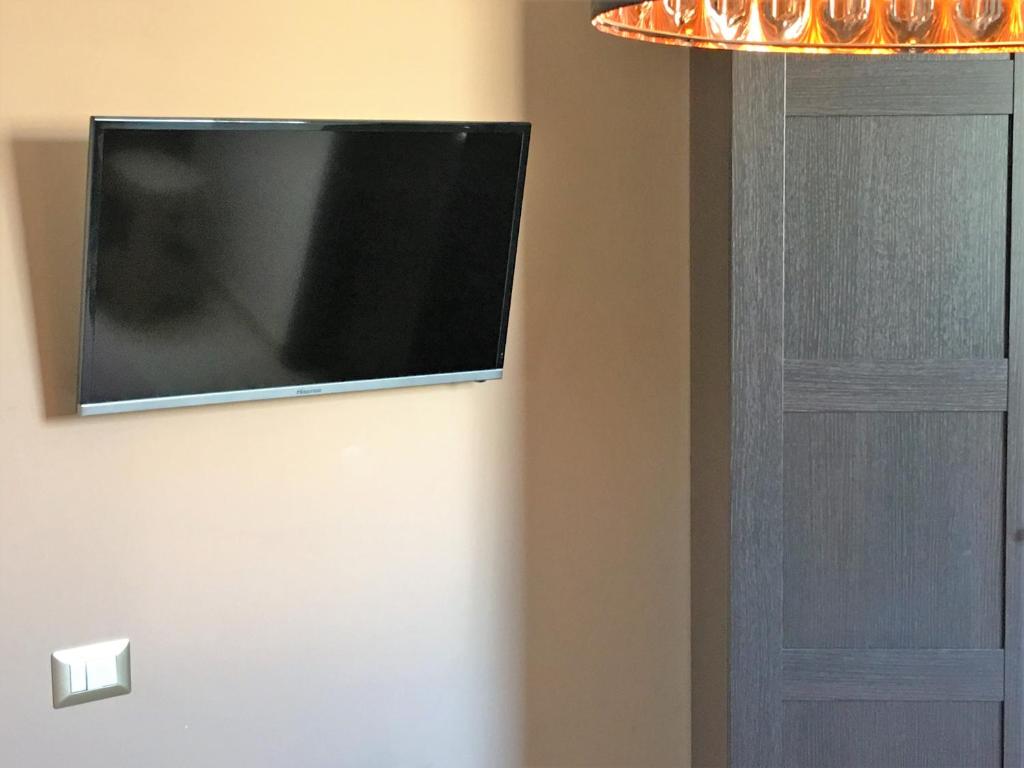 TV a/nebo společenská místnost v ubytování Terrazza Partenopea
