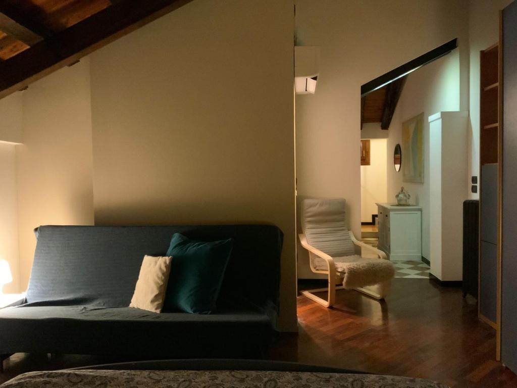 a living room with a couch and a chair at Ca' Molinetto in Treviso