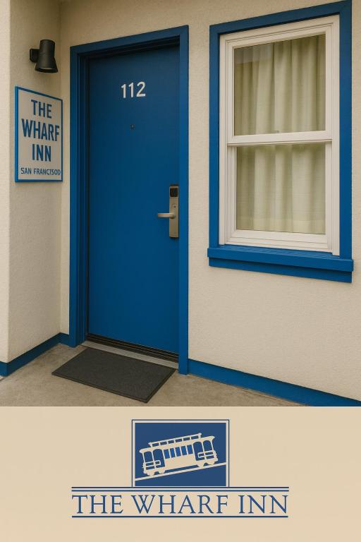 a blue door in a building with a window at The Wharf Inn in San Francisco
