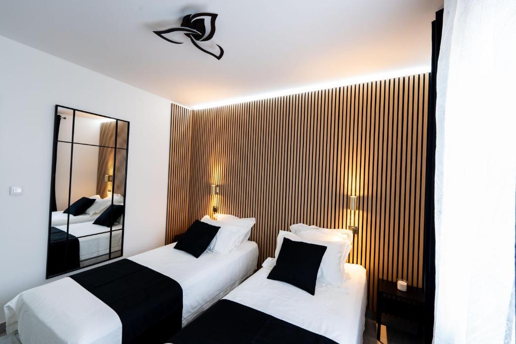 Voodi või voodid majutusasutuse Déplacements Pro & Détente- Hébergement Calme avec Spa toas