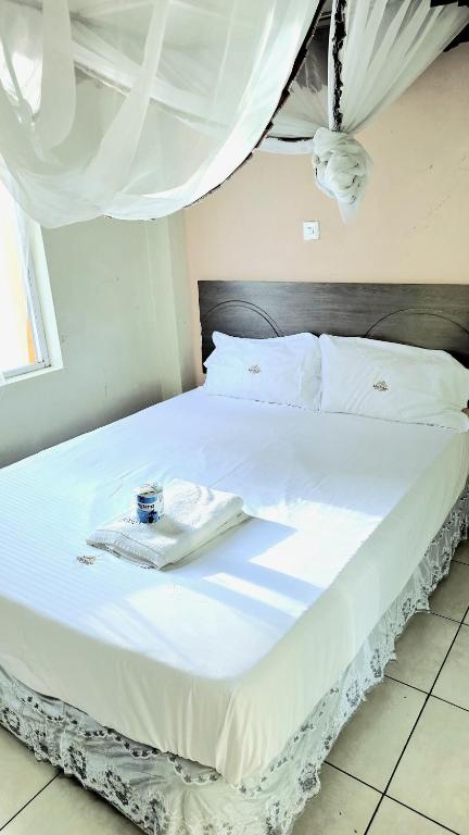 Ένα ή περισσότερα κρεβάτια σε δωμάτιο στο Loiusiana City Hotel