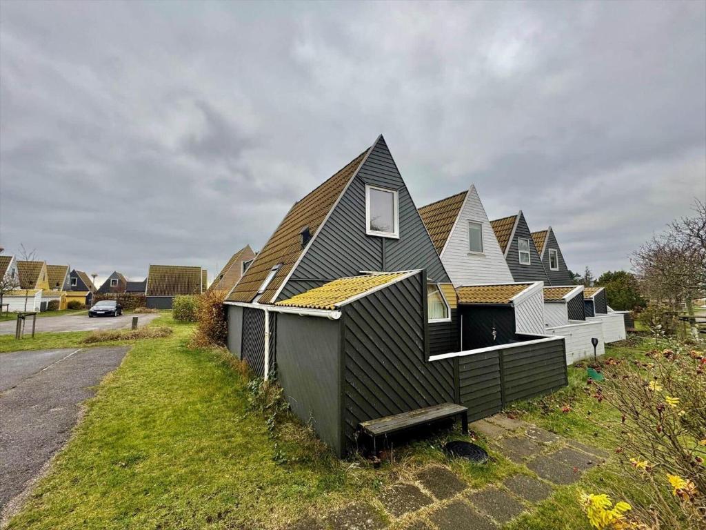 a row of houses with roofs on a street at M398-Gedser-Gedser-Feriepark-32 in Gedser