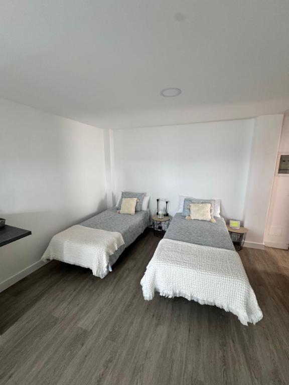 Ένα ή περισσότερα κρεβάτια σε δωμάτιο στο Apartamento junto al mar El Galeón