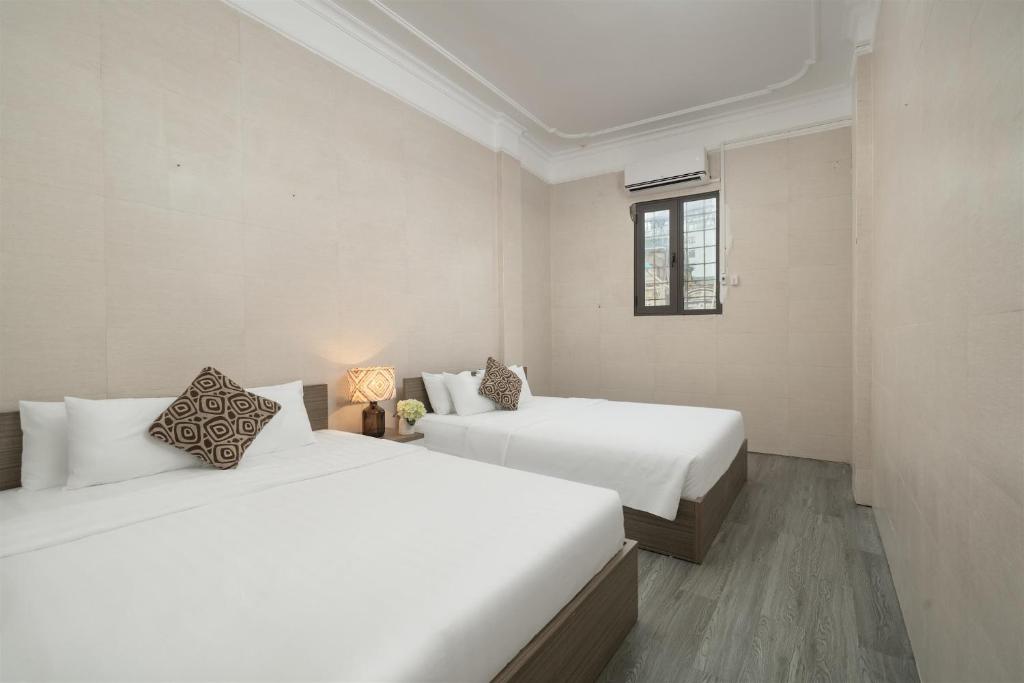 Кровать или кровати в номере Hoàn Kiếm Lake Backpackers Hostel