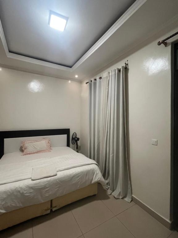 Ένα ή περισσότερα κρεβάτια σε δωμάτιο στο Gistedie Homes Palace