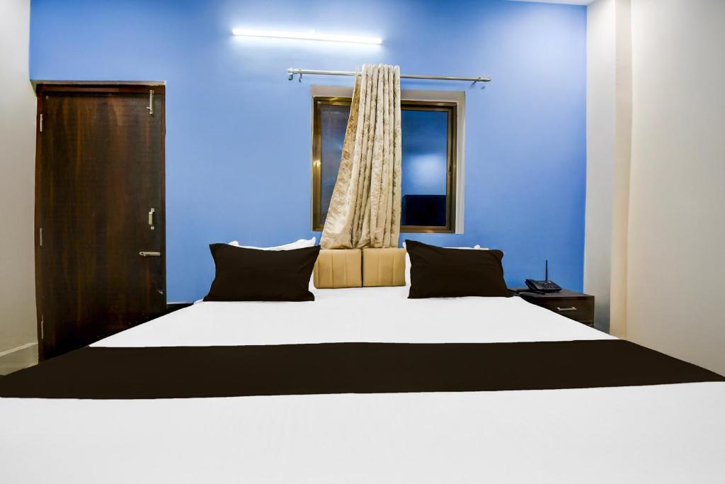 Ένα ή περισσότερα κρεβάτια σε δωμάτιο στο HOTEL O L R