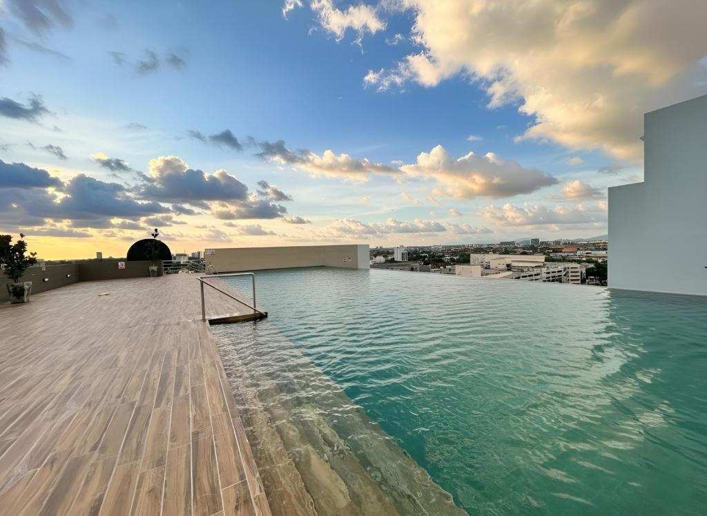a swimming pool on the roof of a building at Podium 3BR 2BH Modern Homestay Near Aeon in Kuching