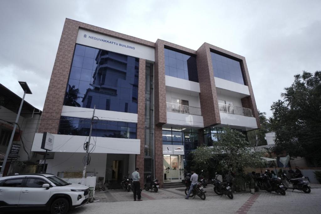 a building with a car parked in front of it at Ambassador Stayz By JA Luxus in Jāmb