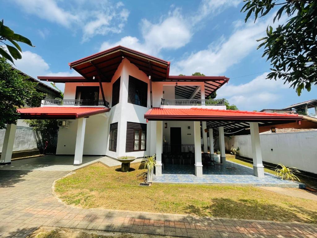 a house with a red roof at Ivy Villa - Tangalle in Tangalle