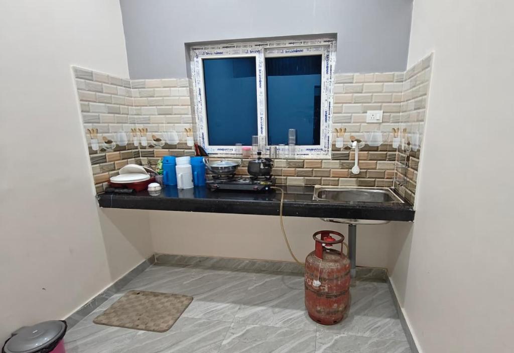 O bucătărie sau chicinetă la Cordinal Homestay