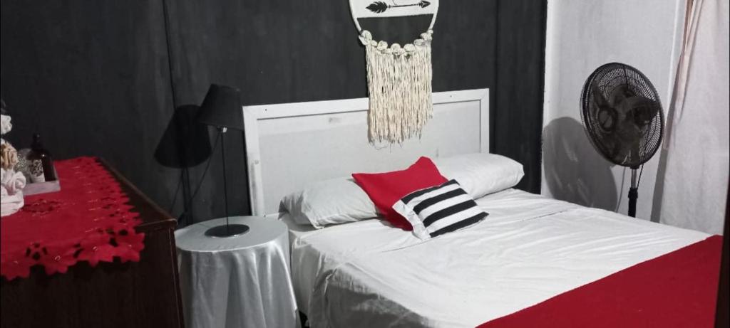 a bedroom with a bed and a basketball hoop at Cabaña HEROES in Villa Los Aromos