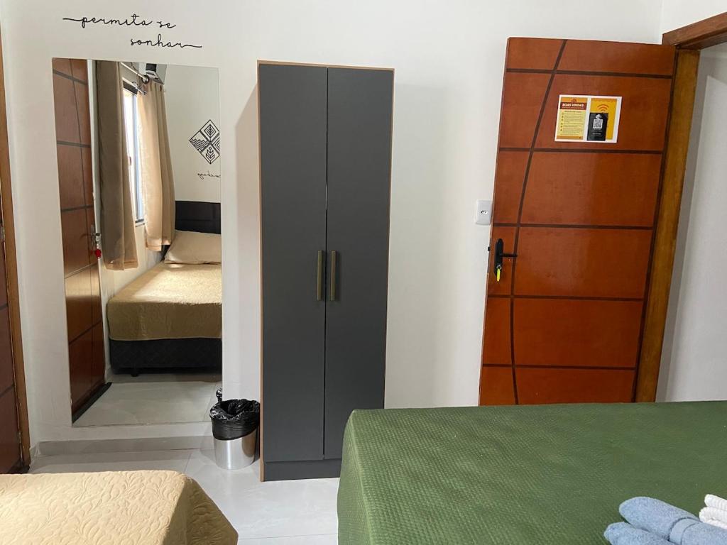 Łóżko lub łóżka w pokoju w obiekcie Casa aconchegante e privativa