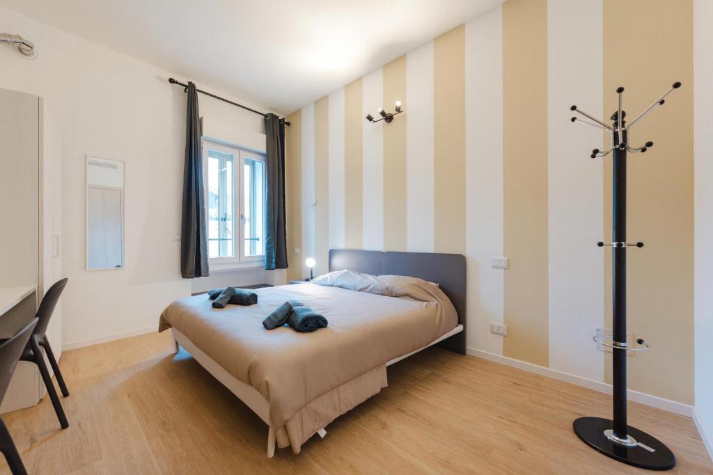 Postel nebo postele na pokoji v ubytování Confortevole Stanza 6 con bagno privato Stazione