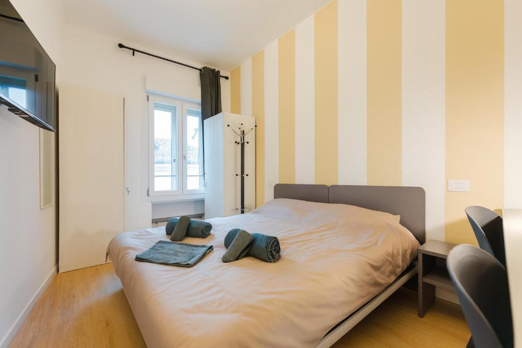 Postel nebo postele na pokoji v ubytování Camera 8 per gruppi e viaggiatori - Stazione