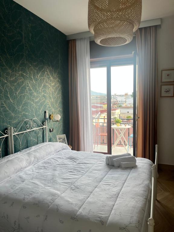 Ένα ή περισσότερα κρεβάτια σε δωμάτιο στο B&B La Rotonda