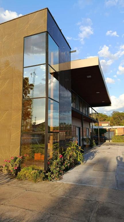 a building with a lot of glass at Barcel Flat in Teresina