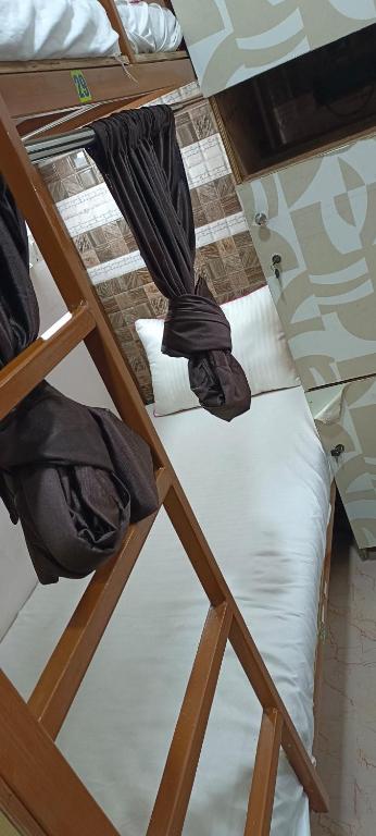 Ένα ή περισσότερα κρεβάτια σε δωμάτιο στο CHHATRAPATI SHIVAJI INTERNATIONAL DORMITORy