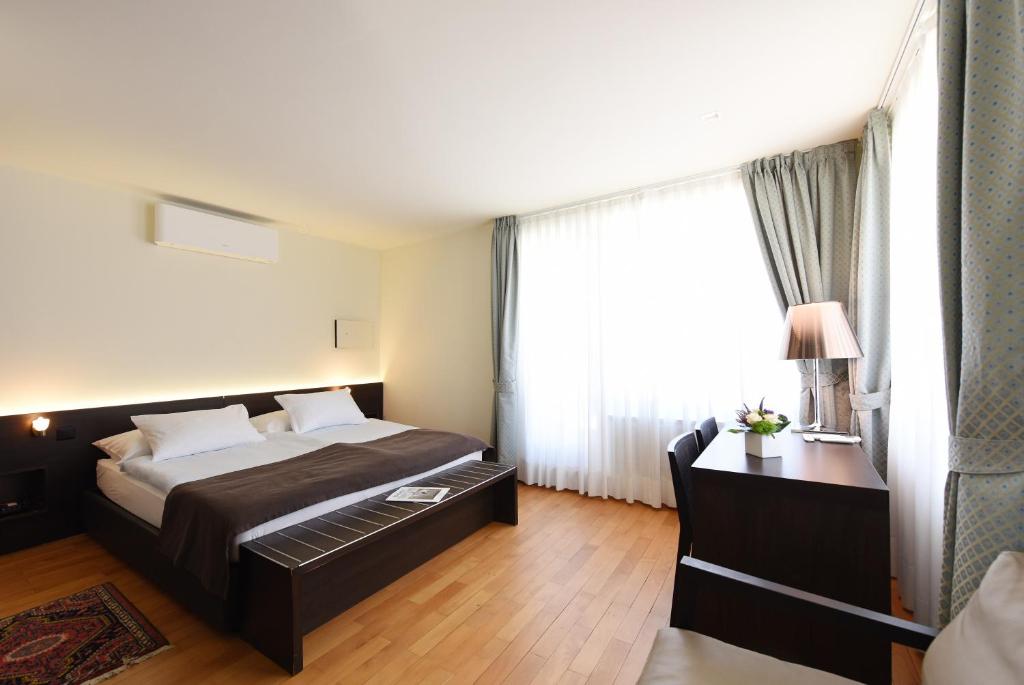 Voodi või voodid majutusasutuse Hotel Walter Au Lac toas
