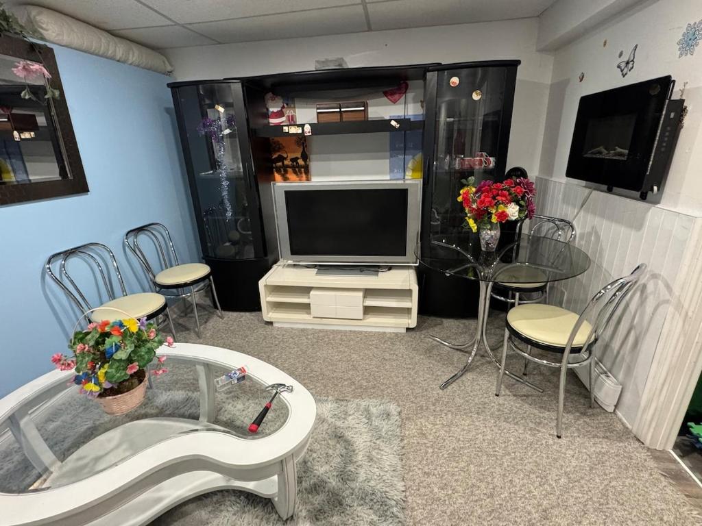 TV/trung tâm giải trí tại Appartement Cool à Longueuil Plan A